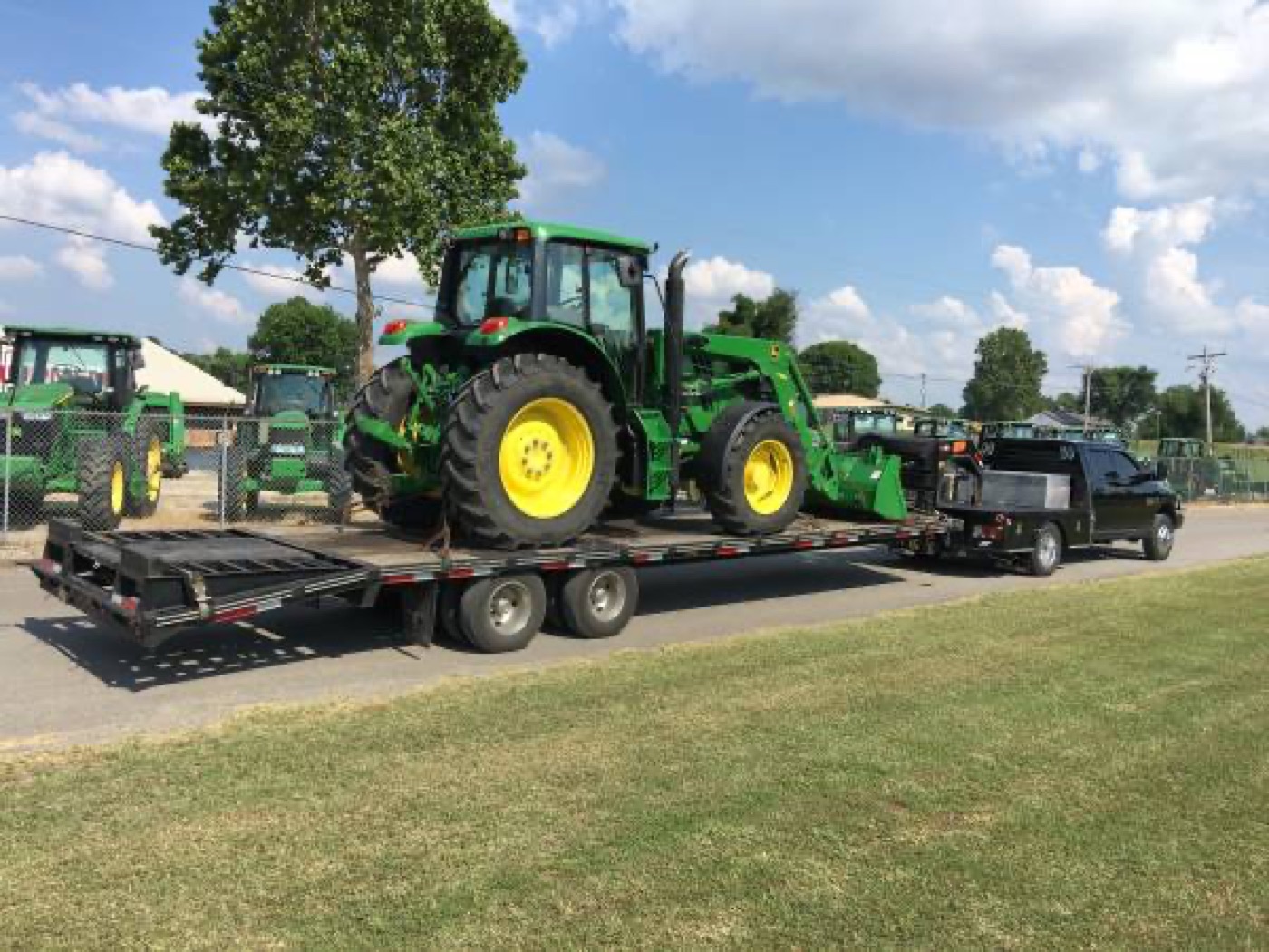 John Deere tractor loaded on a trailer for delivery by Hanover Farm Equipment